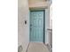 Stylish light blue front door with a modern design enhancing the home's curb appeal at 382 Gracious Way, Henderson, NV 89011