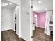 Hallway leading to bedroom with hardwood floors, white walls, and white doors at 382 Gracious Way, Henderson, NV 89011