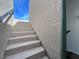 Exterior stairway leading up to a rooftop deck under a bright blue sky at 382 Gracious Way, Henderson, NV 89011