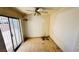 This bedroom offers a ceiling fan and sliding glass door access to the yard at 3974 Palos Verdes St, Las Vegas, NV 89119