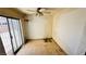 This bedroom offers a ceiling fan and sliding glass door access to the yard at 3974 Palos Verdes St, Las Vegas, NV 89119