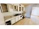 Kitchen needs renovation with old cabinetry, countertops, and hardwood floors at 3974 Palos Verdes St, Las Vegas, NV 89119