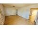 A vacant living room ready for renovation with hardwood floors and textured walls at 3974 Palos Verdes St, Las Vegas, NV 89119