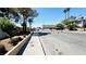 Street view of the property with tall trees along a residential street at 3974 Palos Verdes St, Las Vegas, NV 89119