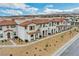 Aerial view of newly constructed homes featuring terracotta tile roofs and desert landscaping at 4 Lomita Heights Dr, Las Vegas, NV 89138