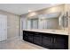 Bathroom featuring a double vanity and a large framed mirror at 4 Lomita Heights Dr, Las Vegas, NV 89138