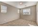 Bright bedroom with neutral walls, carpet, and natural light from two windows at 4 Lomita Heights Dr, Las Vegas, NV 89138