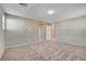 Large bedroom with neutral carpet and view of bathroom and closet at 4 Lomita Heights Dr, Las Vegas, NV 89138