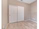 Bedroom closet doors, with neutral paint and tile floors, provide ample storage at 4 Lomita Heights Dr, Las Vegas, NV 89138