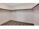 Walk in closet with carpet flooring and rod racks for storage at 4 Lomita Heights Dr, Las Vegas, NV 89138