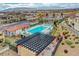 A neighborhood pool surrounded by lounge chairs and a picnic area at 4 Lomita Heights Dr, Las Vegas, NV 89138