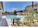 Relaxing community pool area with plenty of seating, spa, and lush landscaping for enjoyment at 4 Lomita Heights Dr, Las Vegas, NV 89138