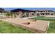 Fun outdoor space with cornhole game setup and tables, perfect for community gatherings at 4 Lomita Heights Dr, Las Vegas, NV 89138