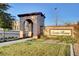 Welcoming Santa Rosa community entrance with landscaped greenery and signature architectural details at 4 Lomita Heights Dr, Las Vegas, NV 89138