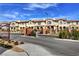 Entrance gate of the home community with lush landscaping on a sunny day at 4 Lomita Heights Dr, Las Vegas, NV 89138