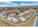 New construction townhomes featuring red tile roofs and garages in a Gathering-friendly Primary-planned community at 4 Lomita Heights Dr, Las Vegas, NV 89138