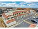 New construction townhomes featuring red tile roofs with attached garages and easy access parking at 4 Lomita Heights Dr, Las Vegas, NV 89138