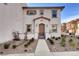 Charming two-story home with desert landscaping, covered entry, and warm exterior paint tones at 4 Lomita Heights Dr, Las Vegas, NV 89138