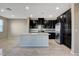 Kitchen showcases dark cabinetry, stainless steel appliances, and a central island at 4 Lomita Heights Dr, Las Vegas, NV 89138