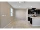 Bright kitchen with modern appliances and a large island with light countertops, and dark cabinets at 4 Lomita Heights Dr, Las Vegas, NV 89138