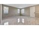Open living area featuring marble floors and natural light from two windows at 4 Lomita Heights Dr, Las Vegas, NV 89138