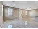 Spacious living area featuring marble floors and plenty of natural light at 4 Lomita Heights Dr, Las Vegas, NV 89138