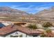 Scenic view overlooking the desert landscape with mountains and neighborhood rooftops at 4 Lomita Heights Dr, Las Vegas, NV 89138