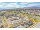 Panoramic aerial view of a Primary-planned community with a mix of homes, roads, and community spaces at 4 Lomita Heights Dr, Las Vegas, NV 89138