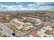 Overhead view of a new residential community featuring modern townhomes with red tile roofs and manicured landscaping at 4 Lomita Heights Dr, Las Vegas, NV 89138