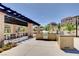 Enjoy outdoor cooking with a full kitchen, bbq grills, and dining area under the pergola at 4 Lomita Heights Dr, Las Vegas, NV 89138