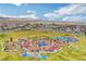 Aerial view of a colorful community playground, featuring a variety of play areas and open green space at 4 Lomita Heights Dr, Las Vegas, NV 89138