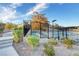 A view of a community pool surrounded by lush landscaping and secure fencing, steps lead up to the pool at 4 Lomita Heights Dr, Las Vegas, NV 89138