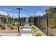 Gated community pool entrance with attractive landscaping and secure access, with clear signage at 4 Lomita Heights Dr, Las Vegas, NV 89138