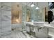 Luxurious bathroom with marble finishes, glass-enclosed shower, and double sinks at 4381 Flamingo Rd # 2612, Las Vegas, NV 89103