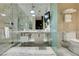 Elegant bathroom featuring marble tiling, glass shower, and modern fixtures at 4381 Flamingo Rd # 2612, Las Vegas, NV 89103