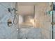 Modern bathroom featuring marble tile, sleek fixtures, and a luxurious soaking tub at 4381 Flamingo Rd # 2612, Las Vegas, NV 89103