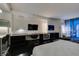 An elegant suite with a workspace, a large TV, and stunning views of the city skyline through floor-to-ceiling windows at 4381 Flamingo Rd # 2612, Las Vegas, NV 89103