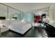 Bright bedroom with a large bed, mirrored wall, and a glimpse of the kitchenette at 4381 Flamingo Rd # 2612, Las Vegas, NV 89103