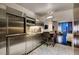 Stylish kitchen featuring stainless steel appliances, bar seating, and marble flooring, seamlessly integrated into the living space at 4381 Flamingo Rd # 2612, Las Vegas, NV 89103