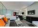 Open-concept living room featuring a sectional sofa, a glass coffee table, and a partial bedroom view at 4381 Flamingo Rd # 2612, Las Vegas, NV 89103