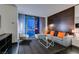 Bright living room featuring a sectional sofa, a glass coffee table, and city views from the balcony at 4381 Flamingo Rd # 2612, Las Vegas, NV 89103