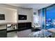 Bright living room featuring a sofa, a glass coffee table, and city views from the balcony at 4381 Flamingo Rd # 2612, Las Vegas, NV 89103