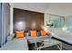 Open-concept living room featuring a sectional sofa, a glass coffee table, and a partial kitchen view at 4381 Flamingo Rd # 2612, Las Vegas, NV 89103