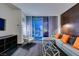 Bright living room featuring a sectional sofa, a glass coffee table, and city views from the balcony at 4381 Flamingo Rd # 2612, Las Vegas, NV 89103