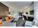 Open-concept living room featuring a sectional sofa, a glass coffee table, and a partial bedroom view at 4381 Flamingo Rd # 2612, Las Vegas, NV 89103