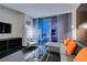 Bright living room featuring a sectional sofa, a glass coffee table, and city views from the balcony at 4381 Flamingo Rd # 2612, Las Vegas, NV 89103