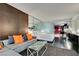 Open-concept living room featuring a sectional sofa, a glass coffee table, and a partial kitchen view at 4381 Flamingo Rd # 2612, Las Vegas, NV 89103