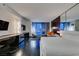A spacious suite featuring a king-sized bed, city views, and a sleek entertainment center and desk area at 4381 Flamingo Rd # 2612, Las Vegas, NV 89103