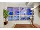 Contemporary bedroom with platform bed, city views through large windows, and minimal decor at 4525 Dean Martin Dr # 2901, Las Vegas, NV 89103