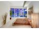 Modern bedroom with platform bed, large window with city view, and stylish decor at 4525 Dean Martin Dr # 2901, Las Vegas, NV 89103